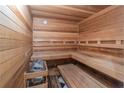 Wooden sauna featuring built-in benches and heater for relaxation and wellness at 2740 Bountiful Pl, Lawrenceville, GA 30045