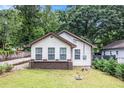 Charming single-story home featuring neutral siding and a welcoming front yard at 523 Mount Zion, Hapeville, GA 30354