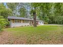 Ranch style home featuring a well-maintained lawn and classic design at 3614 N Druid Hills N Rd, Decatur, GA 30033