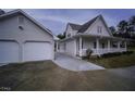 This home includes an attached garage with a covered porch, adding convenience and curb appeal at 385 Eagles Nest Cir, Carrollton, GA 30116