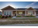Inviting single-story home with brick accents and manicured landscaping at 2929 Rambler Dr, Loganville, GA 30052