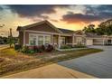 Beautiful single-story home with landscaped yard at sunset at 2929 Rambler Dr, Loganville, GA 30052
