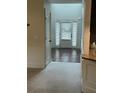 Bright entryway with white door and sidelights, opening to hardwood floors at 4482 Ridge Mill Ne Ter, Douglasville, GA 30135