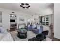 Open-concept living space featuring seamless flow to the kitchen with island and balcony access at 1820 Peachtree St # 1607, Atlanta, GA 30309