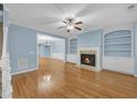 Spacious living room with fireplace, built-in shelving, and hardwood floors at 6206 Carriage Gate Se Ln # 6, Mableton, GA 30126