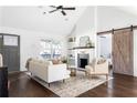Cozy living room with dark hardwood floors, fireplace, and mantel at 1364 Westboro Sw Dr, Atlanta, GA 30310