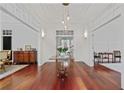 Elegant foyer showcasing hardwood floors, paneled walls, and stylish lighting fixtures at 4356 N Buckhead Ne Dr, Atlanta, GA 30342