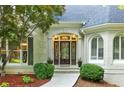 Elegant front entrance features a decorative glass door and arched transom window at 10635 N Edgewater, Johns Creek, GA 30097