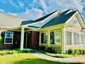 Attractive brick and siding home with a walkway leading to the entrance, featuring a sunroom at 1535 Duluth Hwy # 1101, Lawrenceville, GA 30043