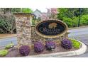 Stone entrance to The Orchards of Sugarloaf Parc, adorned with beautiful landscaping at 1535 Duluth Hwy # 1101, Lawrenceville, GA 30043