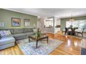 Spacious living room showcases hardwood floors that flow into an adjacent dining area and kitchen at 2190 Stephen Long Ne Dr, Atlanta, GA 30305