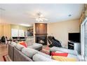 Inviting living room featuring a fireplace, plush seating, and plenty of natural light at 129 Finsbury Ln, Woodstock, GA 30188