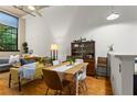 Sunlit dining area features wood floors, a table with seating for six, and a classic display cabinet at 19 Hilliard Se St # 13, Atlanta, GA 30312