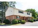 A charming two-story home with well-maintained landscaping and ample parking, showcasing its appealing curb appeal at 3322 Northcrest Rd # A, Atlanta, GA 30340