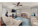 Bright living room with hardwood floors, fireplace, and stylish furnishings, offering a comfortable gathering space at 1364 Keys Crossing Ne Dr, Atlanta, GA 30319