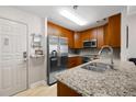 The kitchen features stainless steel appliances, granite countertops, and wooden cabinets at 1101 Juniper Ne St # 1216, Atlanta, GA 30309