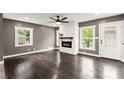 Bright living room featuring a modern fireplace, gleaming hardwood floors, and ample natural light at 3034 Barksdale Cir, Atlanta, GA 30344