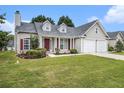 Beautiful single-story home with a well-maintained front yard and a double garage at 7008 Glen Valley Way, Fairburn, GA 30213