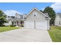 Attractive home showcasing a spacious driveway and a convenient two-car garage at 7008 Glen Valley Way, Fairburn, GA 30213