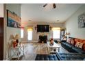 Bright living room with hardwood floors, fireplace, and comfortable seating arrangements at 504 Cole Creek Dr, Dallas, GA 30157