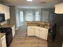 Modern kitchen with granite countertops, stainless steel appliances, and ample cabinet space at 5755 Belmont Ridge Cir, Lithonia, GA 30038