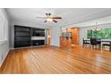 Spacious living room featuring gleaming hardwood floors and an open floor plan at 23 Hunting Creek Dr, Marietta, GA 30068