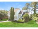 Charming two-story home featuring a spacious front yard and inviting curb appeal at 2325 E Hill Way, Norcross, GA 30071