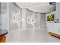 Elegant lobby featuring modern lighting, tiled floors, and a stylish reception desk, creating a welcoming atmosphere at 250 Pharr Ne Rd # 1814, Atlanta, GA 30305