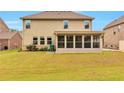 The back of the house features a screened porch and a spacious backyard at 4708 Tiger Blvd, Duluth, GA 30096