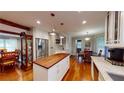 Beautiful kitchen featuring an island with a wood countertop and stainless steel appliances at 2884 Overwood Ln, Snellville, GA 30078