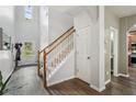 Bright foyer with hardwood floors, staircase, and a view to the front door at 2910 Cross Creek Dr, Cumming, GA 30040