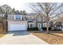 Attractive two-story home with a stone facade and two-car garage; long driveway at 3448 Craggy Perch, Douglasville, GA 30135