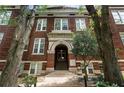Detailed view of the brick facade and arched entryway of this Home Park School building, showcasing architectural charm at 1031 State Nw St # 106, Atlanta, GA 30318