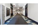 Long hallway with lockers and checkered tile, leading to various rooms in the building at 1031 State Nw St # 106, Atlanta, GA 30318