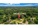 Aerial view of a beautiful home at 125 Legacy Way, surrounded by lush greenery at 125 Legacy Way, Oxford, GA 30054