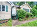 Inviting front entrance featuring a quaint porch and verdant landscaping at 273 Apalachee Church Rd, Auburn, GA 30011