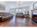 Spacious living room with hardwood floors, a fireplace, and a large window at 504 Hillcrest Cross Rd, Canton, GA 30115