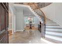 Grand foyer showcasing a curved staircase and open floor plan at 5145 Saddlebred Ln, Cumming, GA 30028