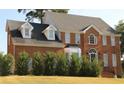 Classic brick home with dormer windows and covered front entry at 6868 Wynbrooke Cv, Stone Mountain, GA 30087