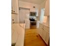 Modern kitchen with stainless steel appliances, white cabinets, and contrasting countertops at 2230 Peachtree Road Nw Rd # A4, Atlanta, GA 30309