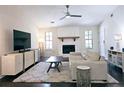Comfortable living room features a stone fireplace, hardwood floors, and a neutral color palette at 2405 Ingram Rd, Duluth, GA 30096