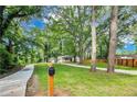 Well-maintained front yard featuring a long driveway and a charming mailbox at 500 Pomoma Circle Sw, Atlanta, GA 30315