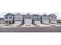 Charming row of townhomes displaying a variety of stylish exterior finishes and well-maintained curb appeal at 6011 Pine Bluff Pl, Conyers, GA 30013