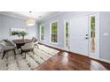 Dining room featuring hardwood floors, natural light, and modern furnishings at 701 Robert Ln, Canton, GA 30114