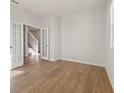 A view of the hardwood floors in a well-lit office space with white walls and french doors at 777 Ruddy Drive (Lot20), Grayson, GA 30017