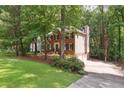 Exterior view of a two-story home with a brick front, siding, and a driveway at 2863 Landing Dr, Marietta, GA 30066