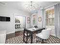 Bright office with hardwood floors, modern lighting, and large windows with stylish curtains at 410 Concord St, Alpharetta, GA 30009