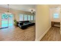 Open concept living room with hardwood floors and sliding glass doors at 750 Summerstone Ln, Lawrenceville, GA 30044