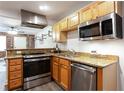 Well-equipped kitchen showcasing stainless steel appliances, modern cabinetry, and attractive granite countertops at 40 Daniel Se St # 1, Atlanta, GA 30312