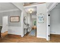 Inviting foyer with hardwood floors, neutral paint, and decorative accents, showcasing a welcoming entrance at 209 Breckenridge Ct, Canton, GA 30115